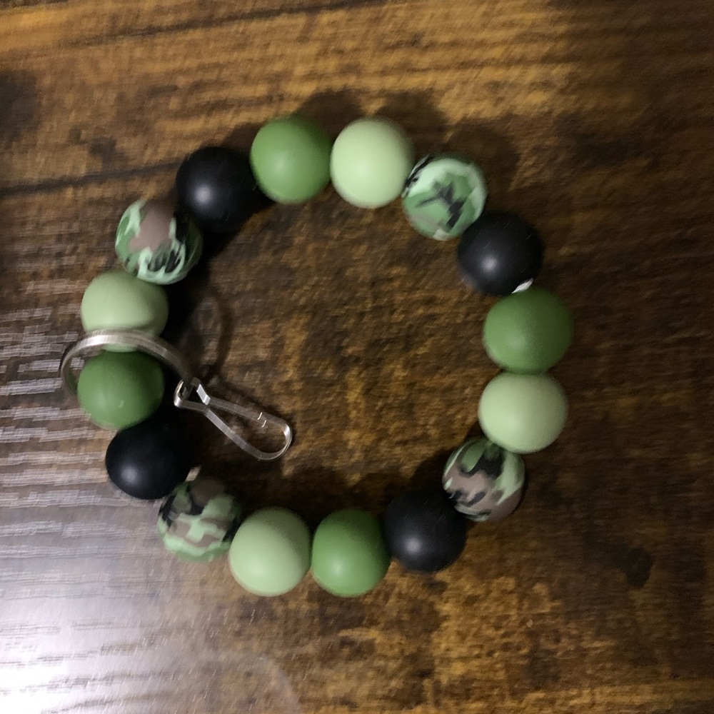 Bracelets or key chain or tethers. Made from silicone beads. have a side job